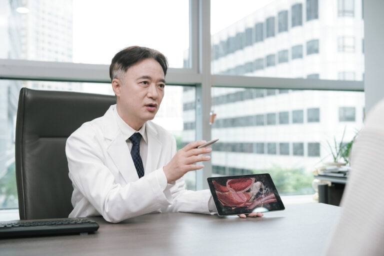 Dr. Min-Jong Lee discussing syphilis testing with a patient
